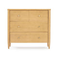 Mid-century modern light natural wood dresser with four drawers, round metal knobs and tapered legs