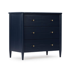 Navy blue three-drawer wooden dresser with brass knobs and tapered legs, mid-century modern bedroom storage chest
