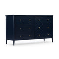 Navy blue six-drawer wood dresser, mid-century modern style with brass knobs and tapered legs, isolated on white background