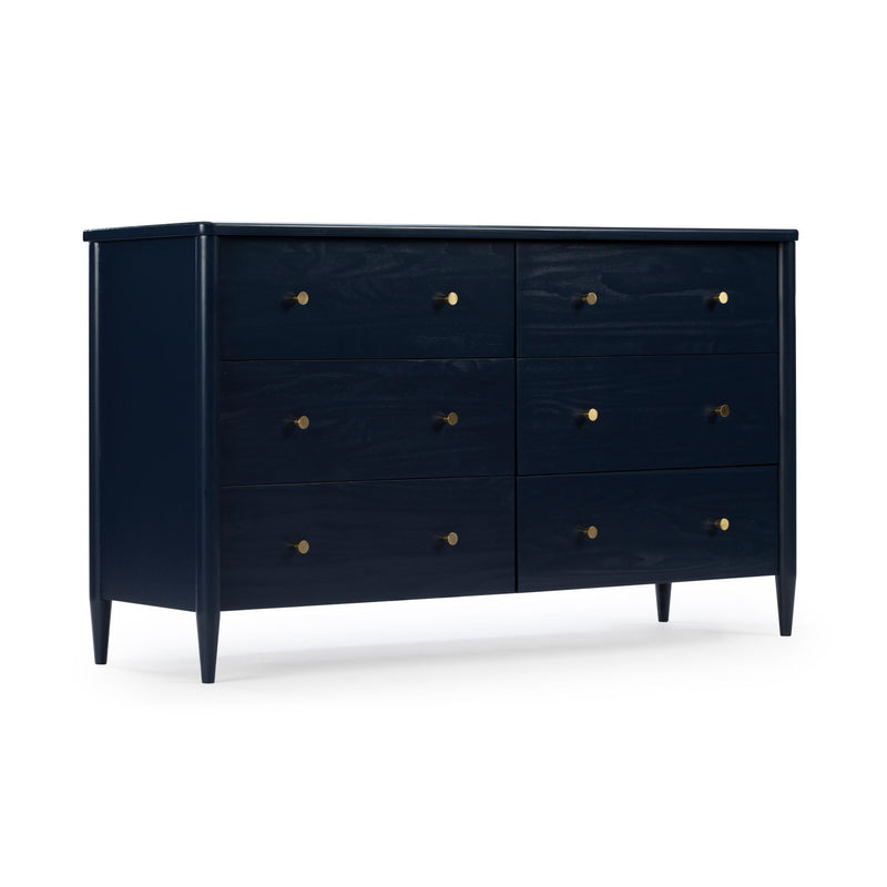 Navy blue six-drawer wood dresser, mid-century modern style with brass knobs and tapered legs, isolated on white background
