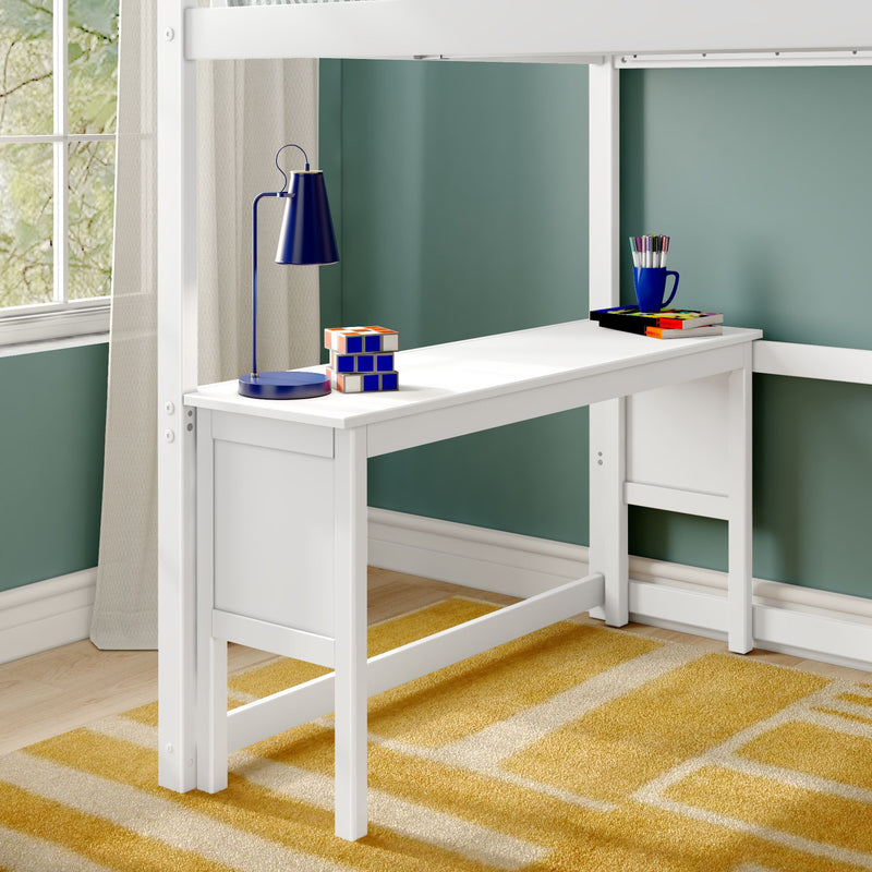 White loft bed with integrated study desk, blue desk lamp, Rubik-style cubes and colored pencils in cup against teal wall on yellow geometric rug