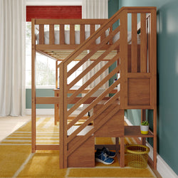 Wooden loft bed with diagonal staircase, built-in desk and storage cubbies over yellow rug, blue sneakers and potted plant in modern kids' bedroom with teal wall and window