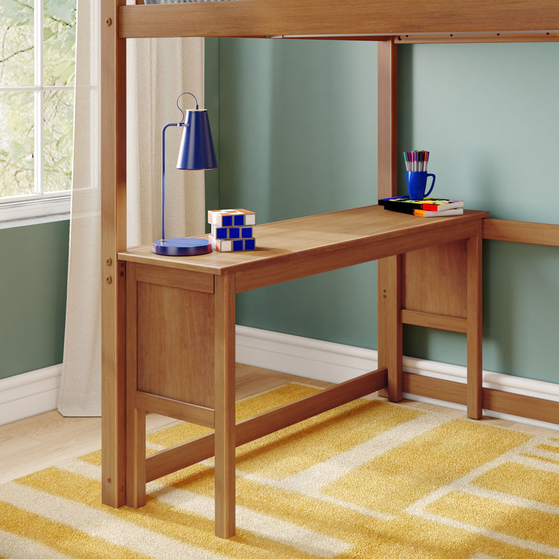 Wooden loft bed with built-in study desk, blue desk lamp, stacked puzzle cubes and colorful pens on a wooden desktop in a child's bedroom with teal walls, natural window light and yellow geometric rug
