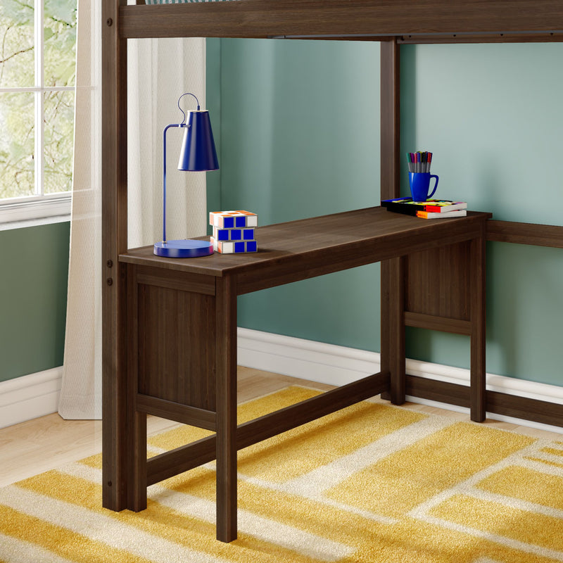 Kids loft bed study desk in dark wood with blue lamp, colorful puzzle cube, pencil mug and books against teal wall and yellow rug