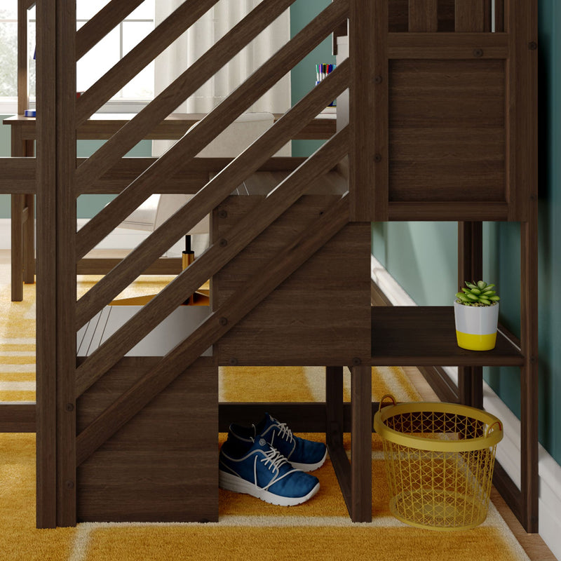 Wooden diagonal‑slatted staircase with built‑in under‑stair storage featuring blue sneakers, yellow wire basket, small succulent in a white-and-yellow pot, striped mustard rug and a glimpse of a home office desk