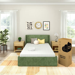 Cozy bedroom with green upholstered bed frame, memory foam mattress, and stylish decor for a modern look.