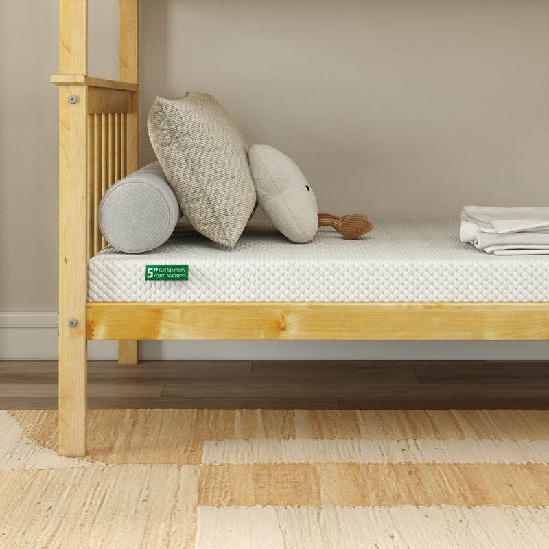 Wooden bunk bed with 5-inch gel memory foam mattress and decorative pillows.