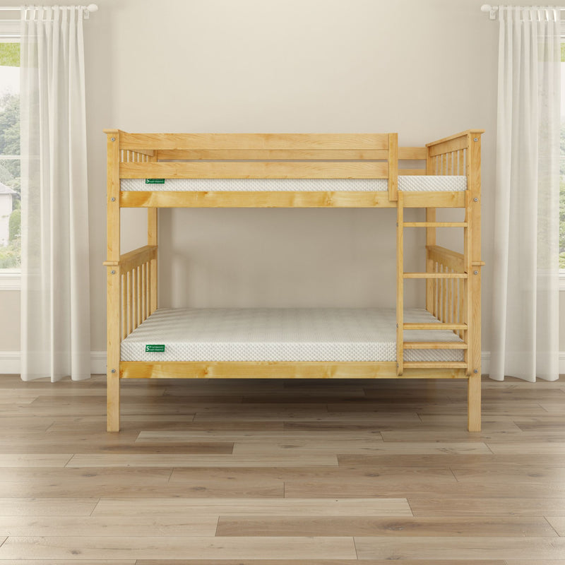 Solid pine twin-over-twin bunk bed with ladder and guardrails, natural wood finish and white mattresses in a minimalist kids bedroom with hardwood floor, neutral walls and white curtains
