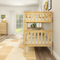 Natural wood bunk bed in bright modern kids' bedroom with large window, dresser, area rug, and potted plant