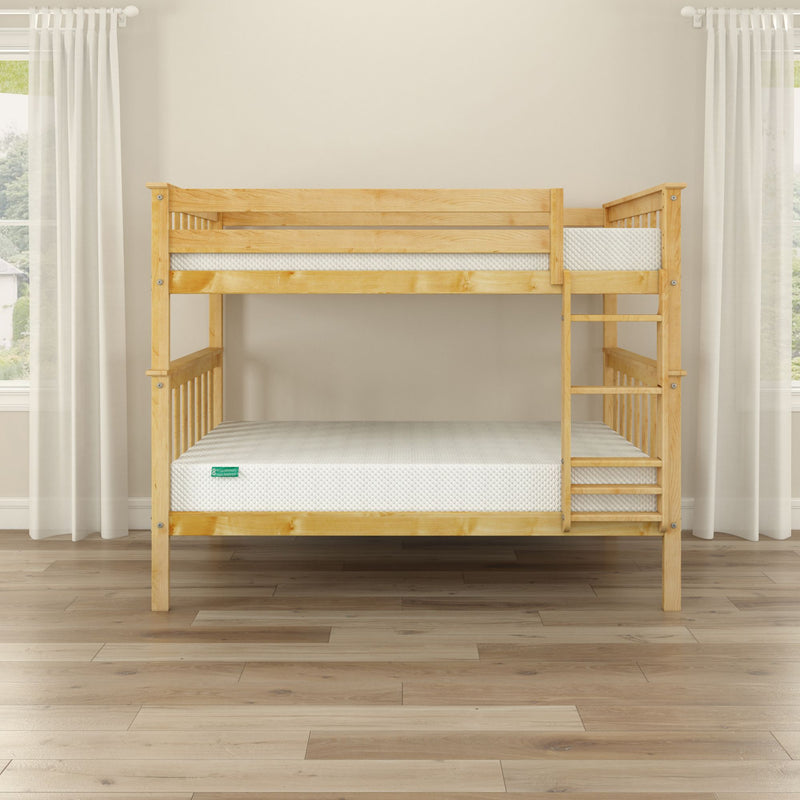 Wooden bunk bed with two mattresses in a bright room with white curtains and wooden floor.