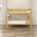 Natural pine twin-over-full wooden bunk bed with ladder, slatted rails and white mattresses in bright minimalist bedroom with hardwood floor and sheer curtains
