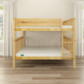 Solid pine wooden bunk bed with ladder and white mattresses in bright minimalist bedroom with light hardwood floors and sheer curtains
