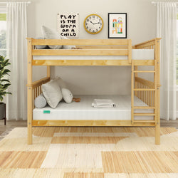 Children's wooden bunk bed with cozy pillows and playful wall art in a bright bedroom setting.