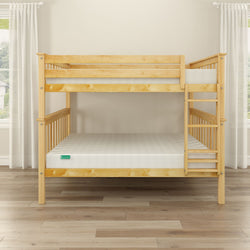 Wooden bunk bed with mattresses in a bright room with natural light and wooden flooring.