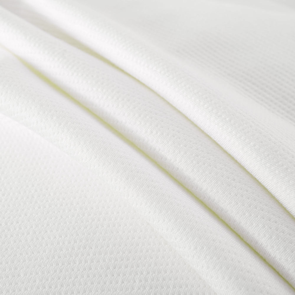 Soft white textured fabric close-up, showcasing high-quality textile material for crafting and sewing projects.