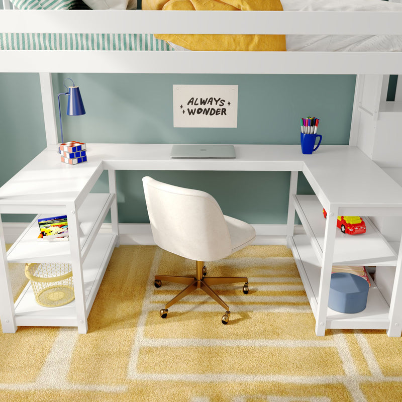 Kids loft bed workspace with white built-in L-shaped desk and white swivel chair, closed laptop, blue desk lamp, colored pencils in a mug, toy blocks on shelves and a yellow patterned rug