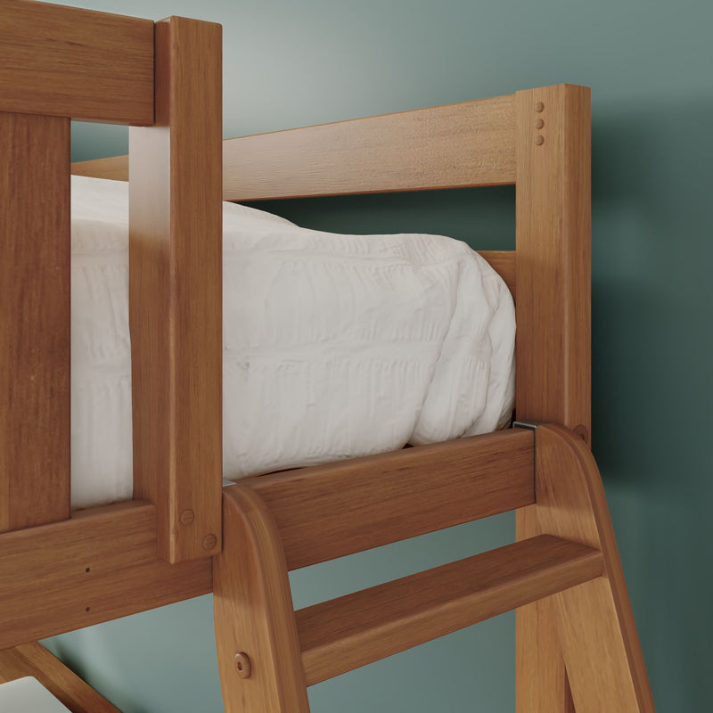 Close-up of a wooden bunk bed ladder and guardrail with white comforter on the top mattress against a teal wall