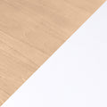 Top-view minimal flat lay of light wood desk and blank white paper diagonally split, clean workspace mockup background