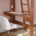 Modern home office workspace with a wooden wall-mounted desk, closed silver laptop, pink desk lamp and white swivel chair against pastel patterned wallpaper