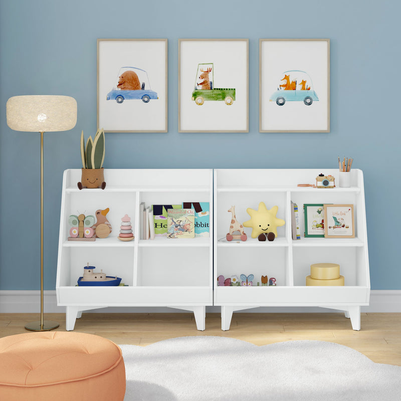 Modern white kids bookshelf toy organizer for nursery and playroom with children's books, wooden toys and storage bins against a blue accent wall topped by three framed watercolor animal car prints, floor lamp, orange pouf and soft rug — nursery storage and playroom decor