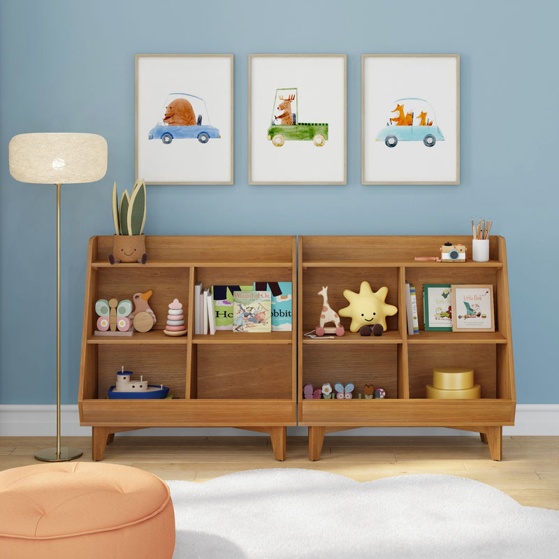Modern kids' room with mid-century wooden toy bookshelf and organizer, blue accent wall, framed animal car prints, floor lamp, plush white rug and orange pouf — nursery decor and children's storage ideas