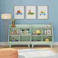 Kids bookshelf and toy storage in mint green nursery with children's books, wooden toys, plush star, and framed animal car wall art