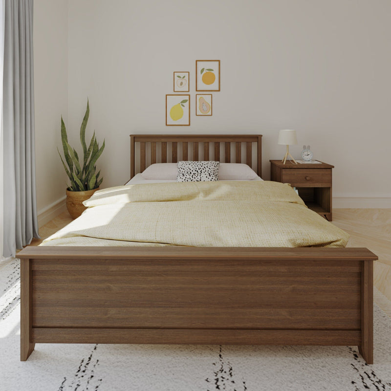 Minimalist bedroom interior with wooden bed frame, beige bedding, bedside table and lamp, potted plant and framed fruit wall art