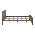 Rustic gray wooden platform bed frame with vertical slat headboard and footboard and wooden slats for mattress support